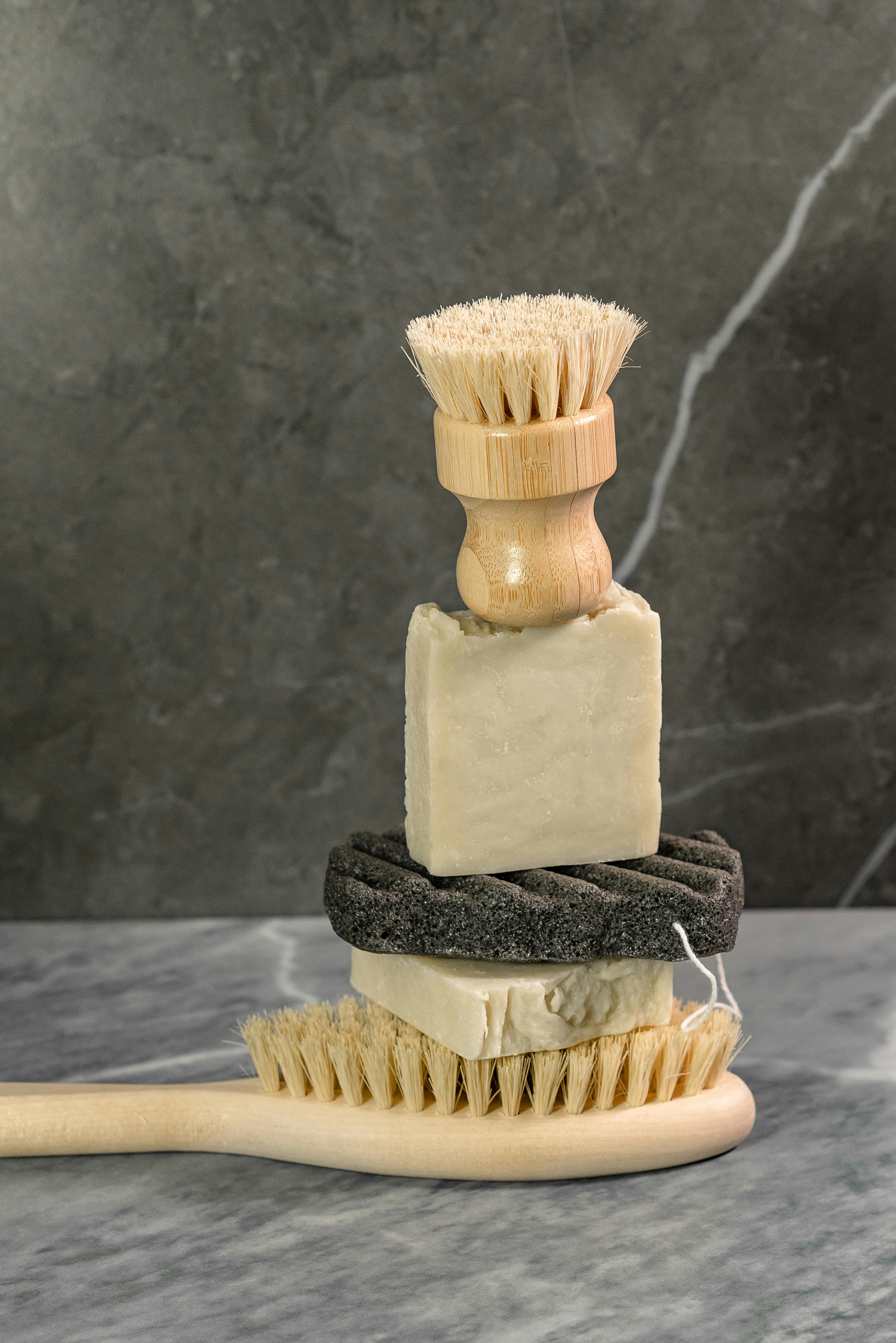 close up of body bath products including soap, body brushes and scrubbers