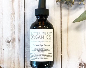 Anti-Aging Organic Facial Serum in wooden background