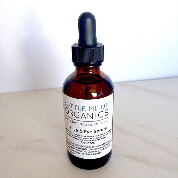 Anti-Aging Organic Facial Serum side top view with plain blurred benchtop backdrop