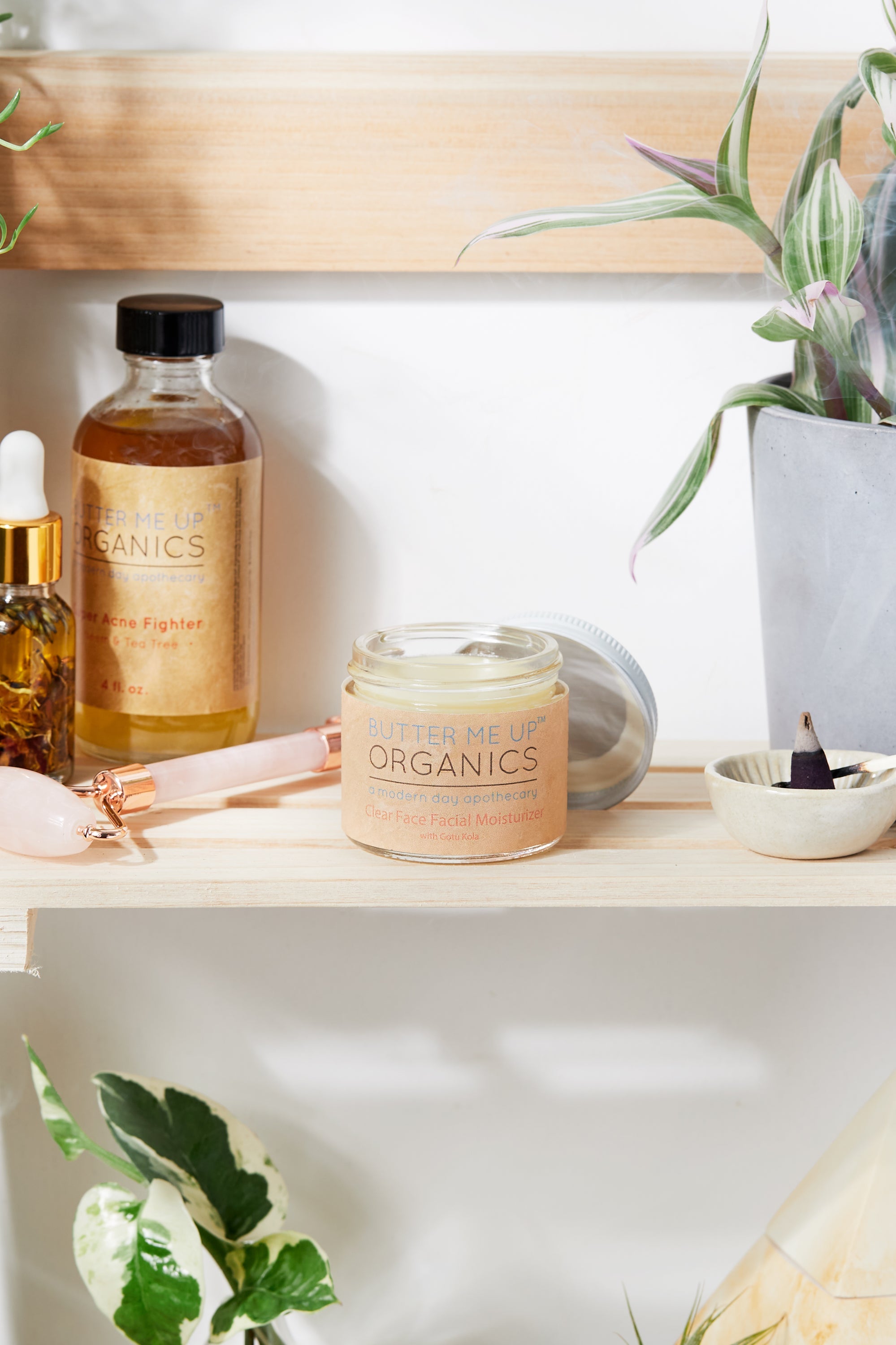 Organic Hydrating Facial Moisturizer with Aloe & Rosehip Oil opened product image in aesthetic shelf backdrop with rose quartz and green leaves
