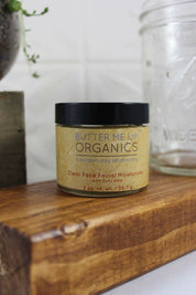 Organic Hydrating Facial Moisturizer with Aloe & Rosehip Oil  close up shot with aesthetic wooden bark backdrop