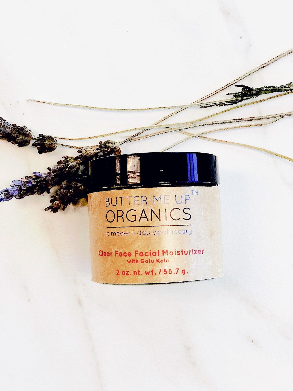 Organic Hydrating Facial Moisturizer with Aloe & Rosehip Oil  birds eye view product image in aesthetic kitchen top white backdrop with lavender leaves for decoration