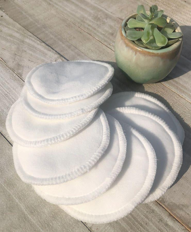 Reusable Bamboo Cotton Makeup Remover Pads close up shot in sun with pot plant on side for visual appeal